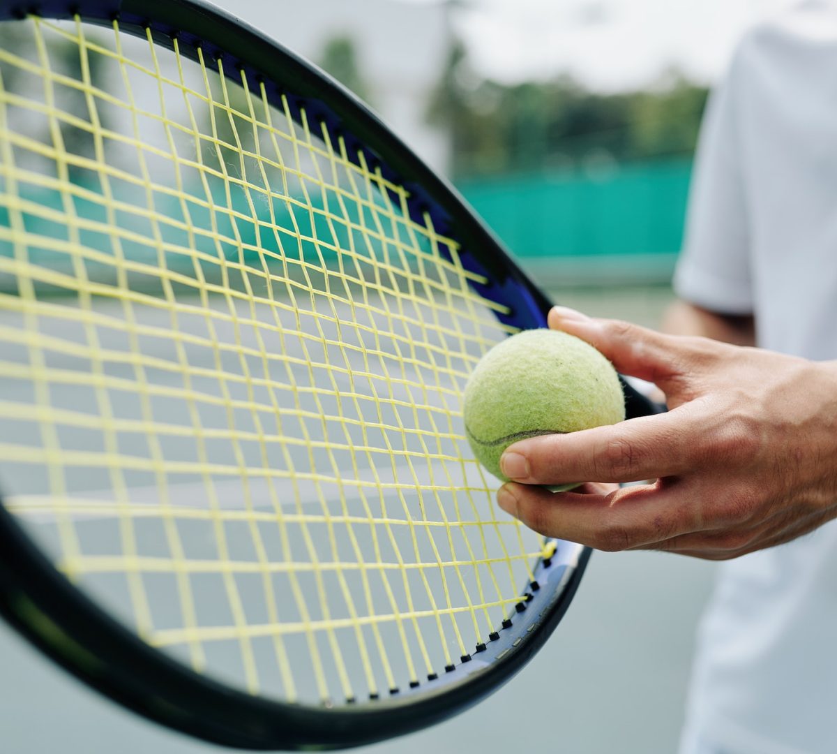 tennis-player-serving-ball.jpg